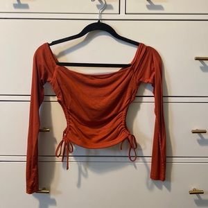 Burnt orange off the shoulder crop top